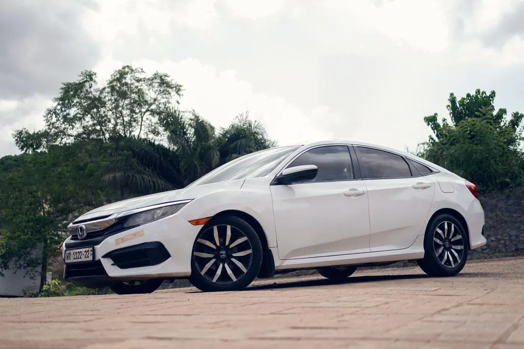 White Honda Civic sedan available to rent in Ghana