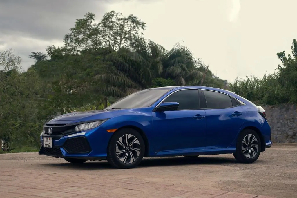 Blue Honda Civic rear three-quarter view