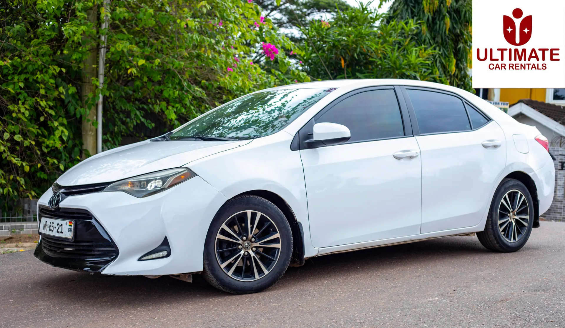 White Toyota Corolla side view